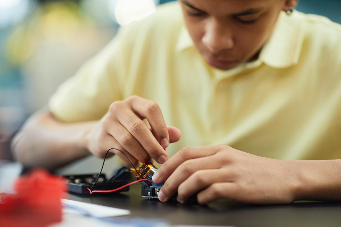 A child exploring electronics at the family computer